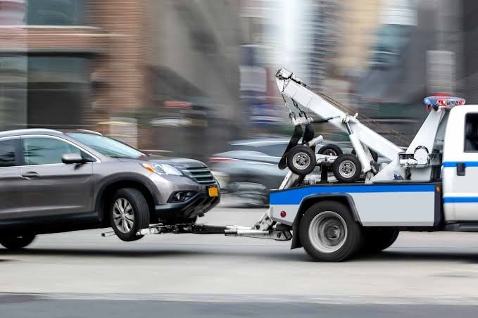 Tow truck towing a car